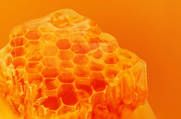 Close up of honeycomb of bees texture.  Hexagonal honeycombs filled with golden nectar. Honeycomb...