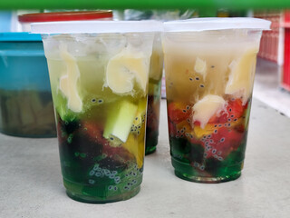 Fruit Soup or Fruit Ice is a mixture of fruit with coconut or simple syrup, served with ice and added condensed milk to add sweetness to the cream. Popular for breaking the fast.