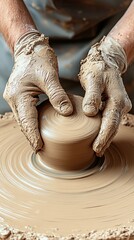 A dedicated artist skillfully shapes a clay statue on a rotating wheel, showcasing precision and artistry in a well-lit studio filled with creative tools