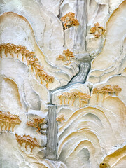 Beautiful wall relief engraving painted in gold, white, and grey mural paint. Chinese wall murals...
