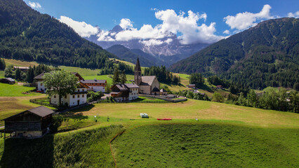 The Odle  Group mountain peaks and the church of Santa Maddalena in the Valley of Funes, South Tyrol in northern Italy. The church is dedicated to St. Magdalene.