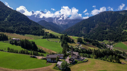 The Odle  Group mountain peaks and the church of Santa Maddalena in the Valley of Funes, South Tyrol in northern Italy. The church is dedicated to St. Magdalene.