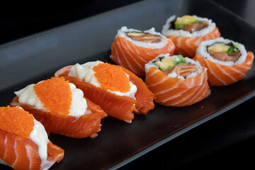 Japanese salmon nigiri with cream cheese and crab roll and salmon rolls