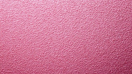 Fototapeta premium Textured pink surface with a subtle pattern, creating a soft and inviting aesthetic.