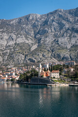 View of the small town of Dobrota with a backdrop of  mountains in Kotor bay, Montenegro
