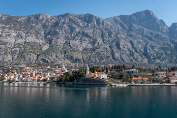 View of the small town of Dobrota with a backdrop of  mountains in Kotor bay, Montenegro