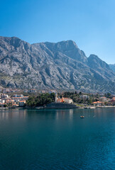 View of the small town of Dobrota with a backdrop of  mountains in Kotor bay, Montenegro