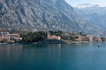 View of the small town of Dobrota with a backdrop of  mountains in Kotor bay, Montenegro
