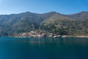 View of a small town with a backdrop of mountains in Kotor bay, Montenegro