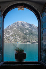 View throu an open window on Our Lady of the Rocks Island, Perast, Bay of Kotor, Montenegro