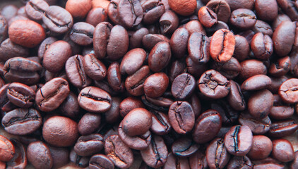 Coffee beans, roasted coffee beans scattered