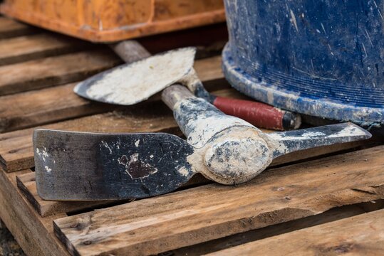 Hand tools lying on wooden pallet