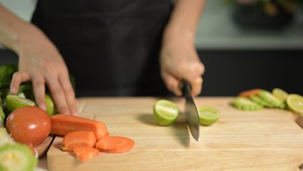 Chopping fresh vegetables home kitchen cooking process bright environment close-up view healthy eating concept