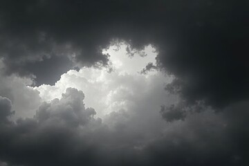 Obraz premium Textured black and white cloudy sky, dark vignette , cloud texture, high contrast