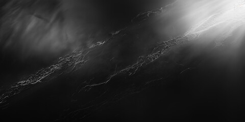 A matte black chalkboard surface with soft scratches and subtle light reflections, creating a moody and textured aesthetic. The dark, abstract backdrop evokes mystery, depth, and creative potential.