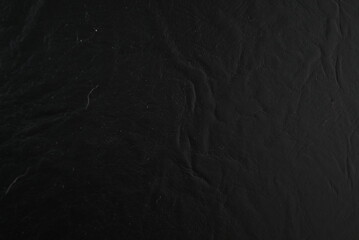 Dark Shimmering Texture with Subtle Sparkle on a Black Surface