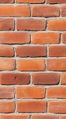 Fototapeta premium A close-up view of a textured red brick wall, showcasing the arrangement and color variations of the bricks.
