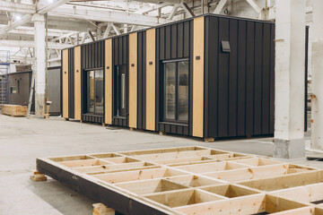 Modular buildings being constructed in a factory setting