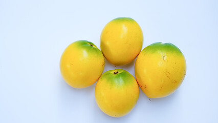 Close up of abiu fruit (golden fruit) isolated on white background, selective focus. Clipping path included.