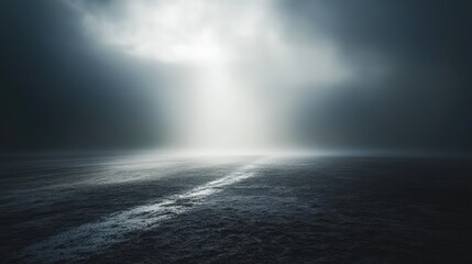Fototapeta premium A fog-filled space with a beam of light cutting through, creating a subtle spotlight effect on the ground.