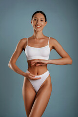 Fototapeta premium Diet conception. Young woman is in the studio against background