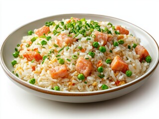 Delicious salmon fried rice with peas and scallions in a ceramic bowl on a white background