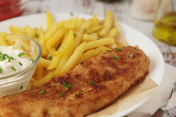 Fish and chips served on the plate, traditional dish of Great Britain