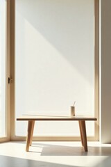 Simple wooden coffee table with a single cup and stick in a sunlit room