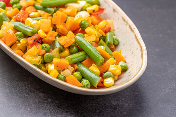 Mexican Mix of Vegetables. Tomatoes, Green Beans, Peas, Corn. Dietary Food.Bright vegetable mix .Vegetarian food.Assorted.