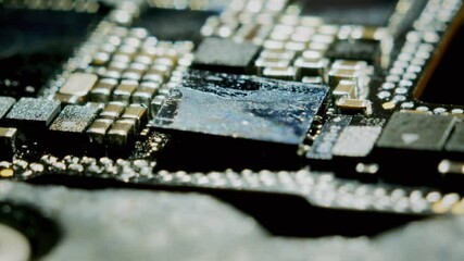 Watch a close-up 4K video capturing the precise installation of an audio codec chip onto a circuit board. The process is shown in stunning macro detail at 60fps, highlighting every step.