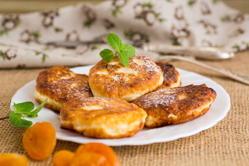 Homemade cheese pancakes with a delicate texture and aromatic dried apricots