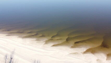 Sandy banks of the river and very low water level.