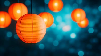 Bright and colorful paper lanterns hanging against a dreamy blue background, creating a festive atmosphere.