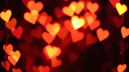 "Heart-shaped bokeh lights on a dark background, perfect for creating a magical and dreamy Valentine's atmosphere. Bokeh, heart, lights, background, dark, romantic, dreamy, Valentine's Day, abstract, 