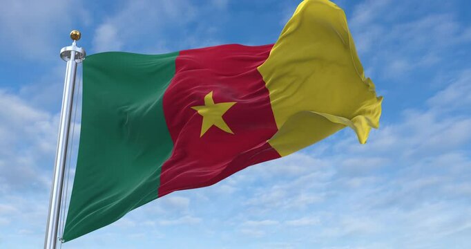 Cameroon flag with flagpole waving in wind, rolling clouds background looping, 4K video (Perfect Loop)