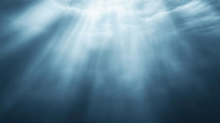 Universal abstract gray-blue background with beautiful rays of illumination. Soft gradient light effect creating a modern and elegant interior wall backdrop for presentations and digital designs.