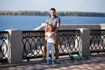 Portrait of a young father with his daughter