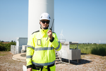 Team of electrical engineer is perform the inspection and maintenance of electric generating windmill turbine.