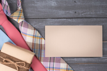 Father's Day Gift Concept with three neckties, a gift and a blank card for added text note.
