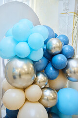 Decoration for the children's birthday party. Beige and blue colors. The boy's first birthday