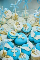 Lots of cakes with Christian symbols. Celebrating a child's christening.