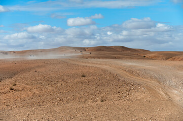 Dusty off-road path through the Agafay desert landscape in Morocco