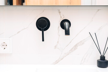 Black built-in faucet in the bathroom