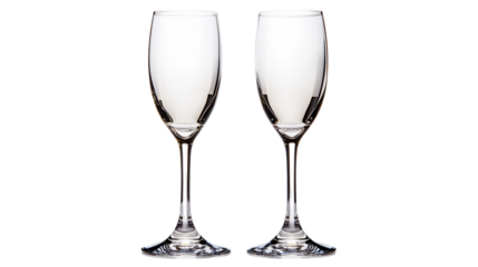 Two empty champagne flutes on black background