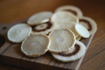 A Wooden Cutting Board With Sliced Mushrooms on Top of It - Generative AI