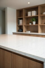 Fototapeta premium Clean White Countertop with Blurred Wooden Shelving and Books in Background