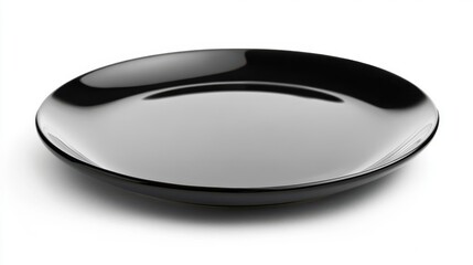 A simple black plate displayed on a white clean surface