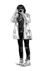  Young girl tourist in jacket photographing on camera, front view, sketch, realistic hand drawn vector