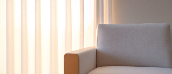 Modern armchair in a bright room with soft curtain and natural light