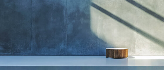 Modern minimalist decor featuring wooden round object on sleek table surface next to wall